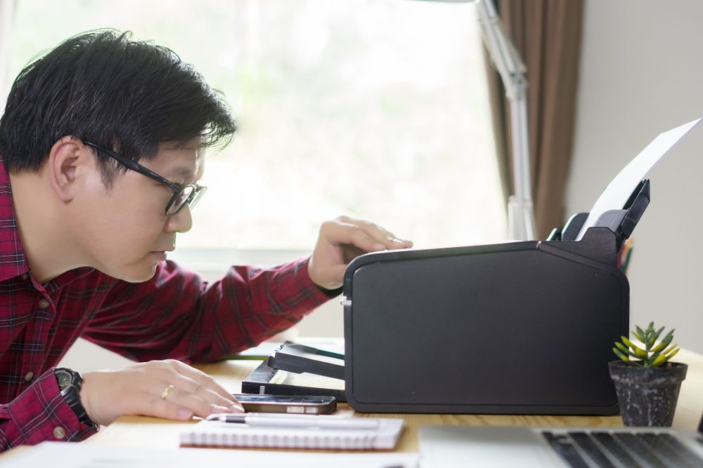 man using the printer